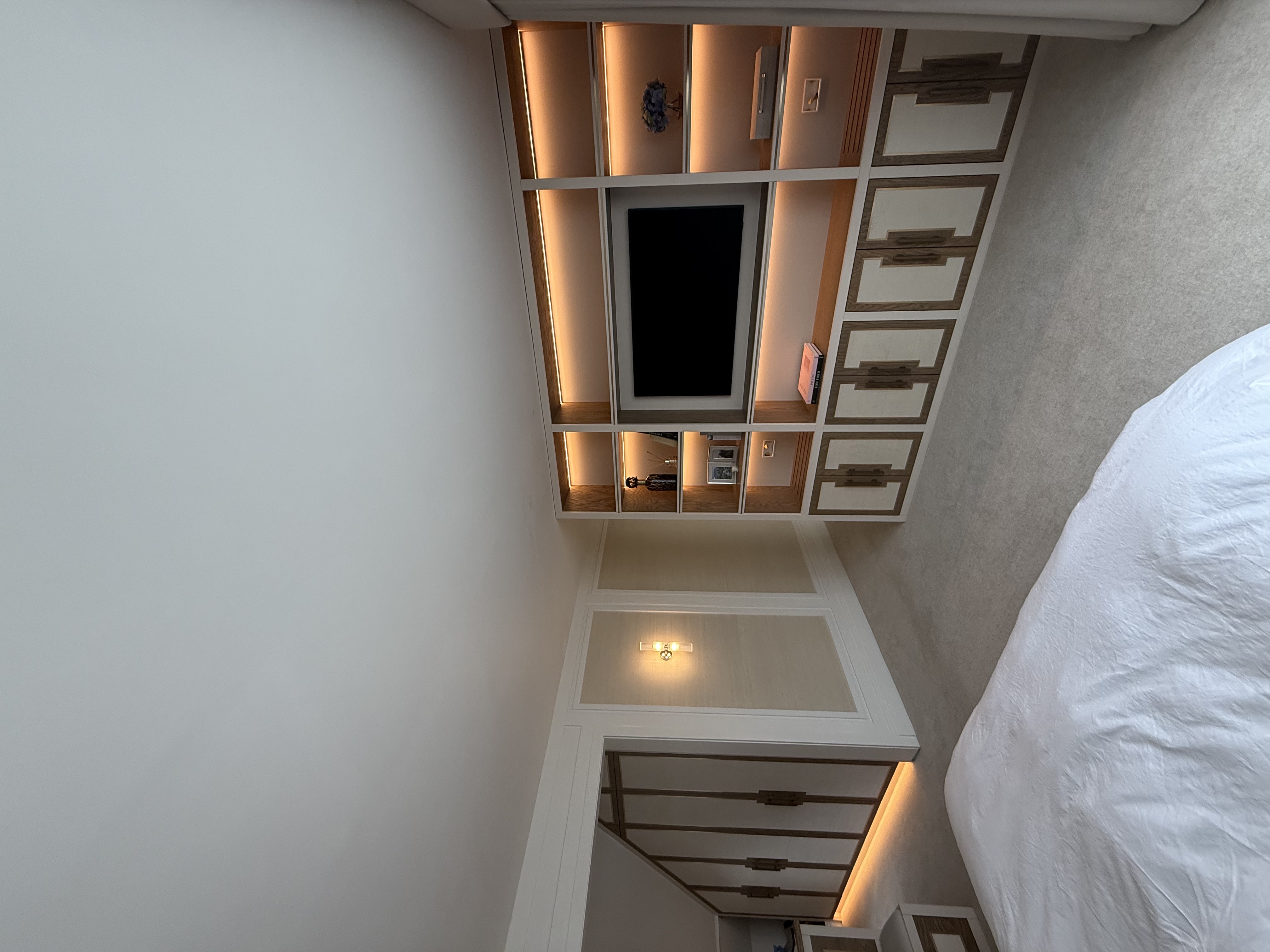 Bespoke fitted bedroom suite with media wall and wardrobes — Manchester by Hafferty Interiors
