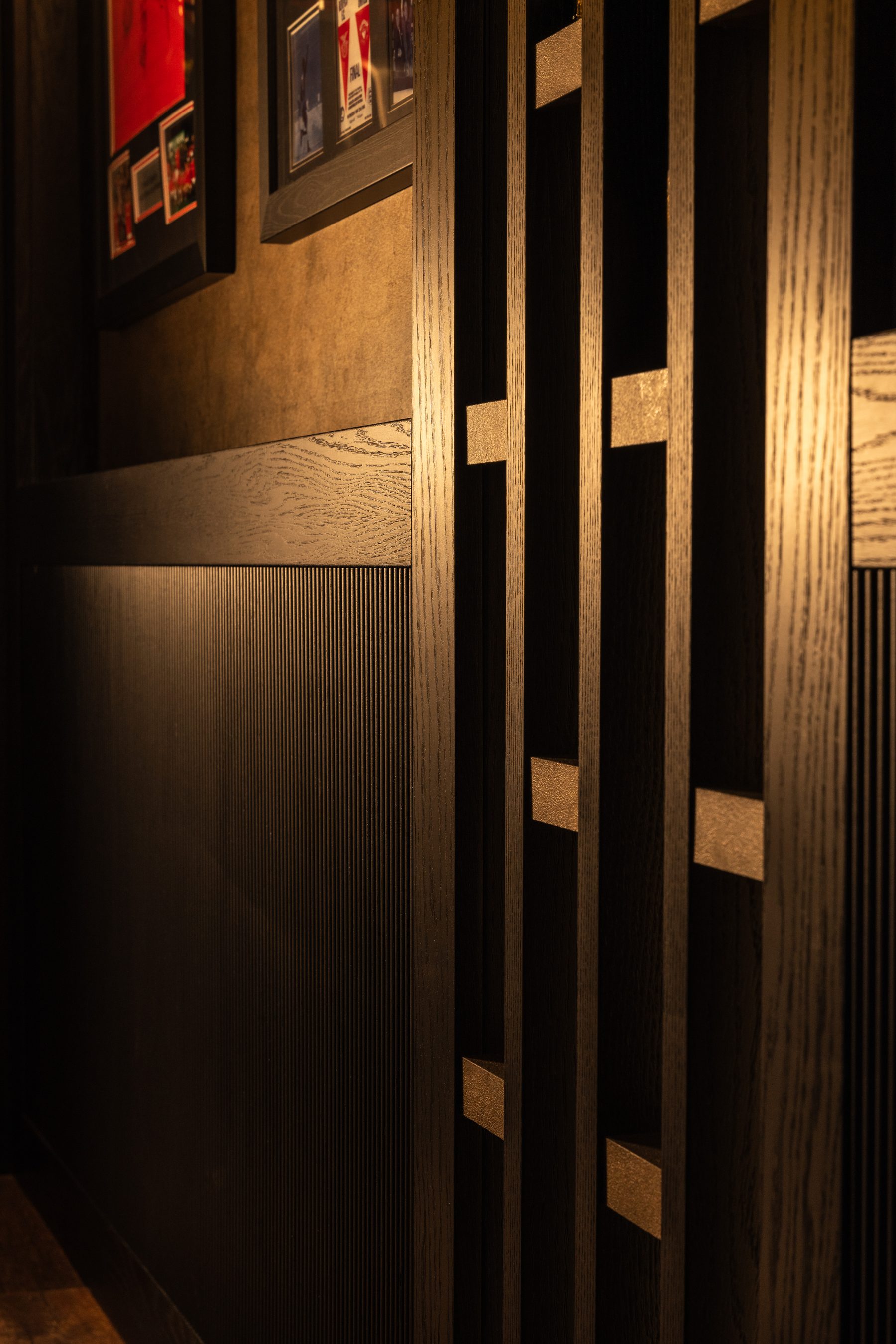 Back-lit bar with onyx panel and lacquered oak frame — Hafferty Interiors Manchester