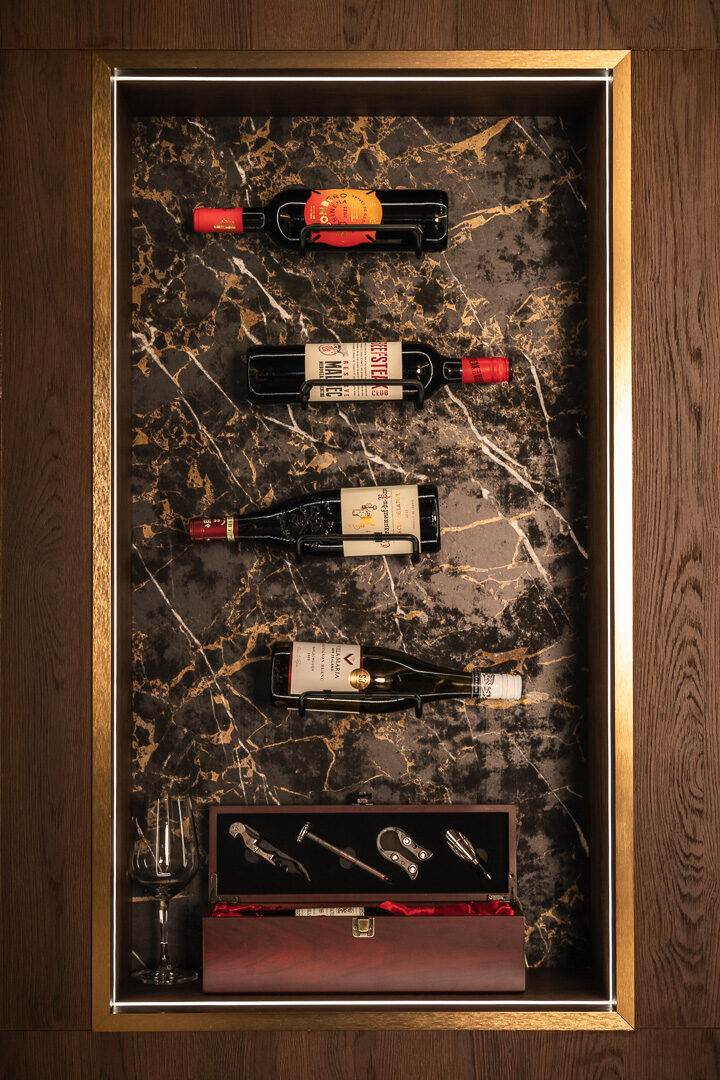 Back-lit spirit display with mirrored panel — Hafferty Interiors bespoke bar Worsley